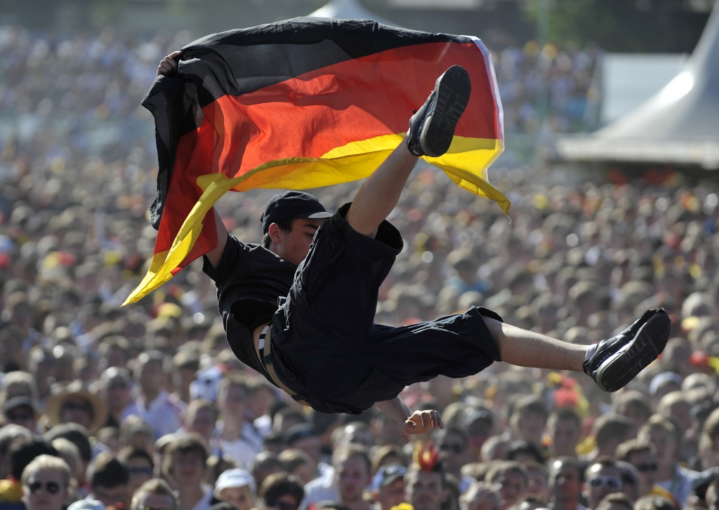 A Germany soccer fan is thrown up in the air during the screening of the 2010 World Cup second round soccer match between Germany and England in northern German city of Hamburg