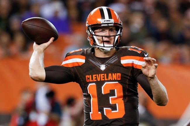 Cleveland Browns quarterback Josh Mc Cown throws in the first half of an NFL preseason football game against the Chicago Bears in Cleveland. Mc Cown spent the summer in trade rumors and Robert Griffin III's sha