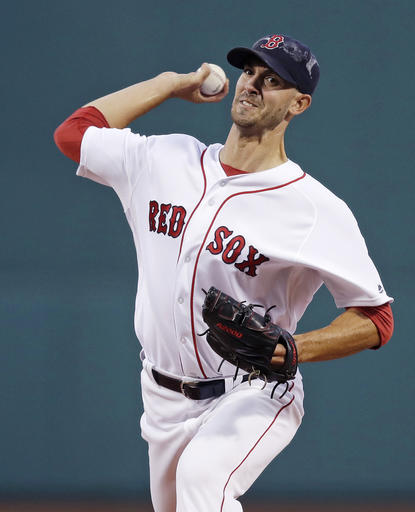 Boston Red Sox starting pitcher Rick Porcello delivers against the Tampa Bay Rays during the first inning of a baseball game at Fenway Park Monday Aug. 29 2016 in Boston