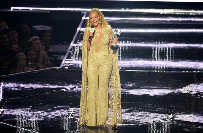 Beyonce accepted the Best Female Video award from Team USA's gold medallist gymnasts