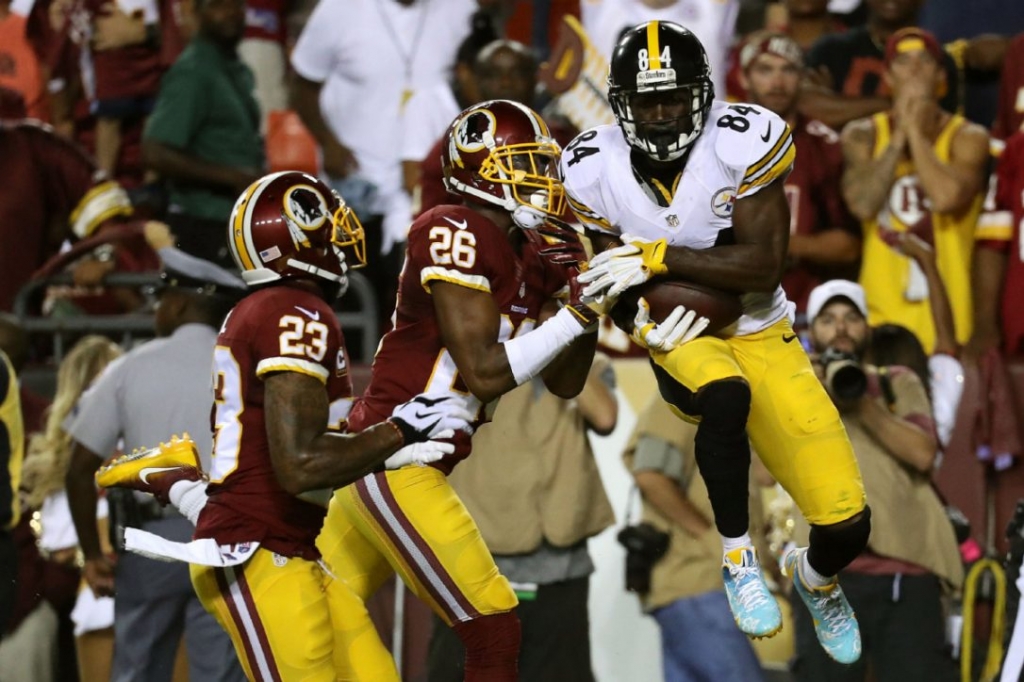 Pittsburgh receiver Antonio Brown scores a second-quarter touchdown past Washington cornerback Bashaud Breeland centre and strong safety De Angelo Hall. The Steelers won 38-16