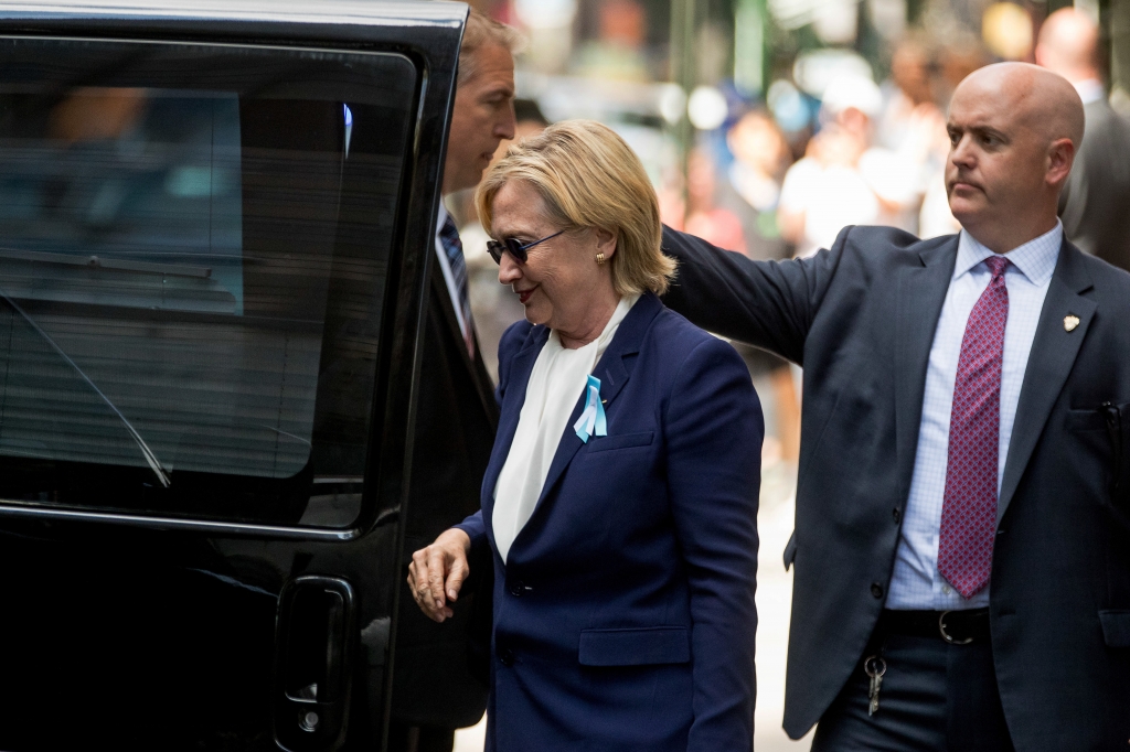 Democratic presidential candidate Hillary Clinton gets into a van as she leaves an apartment building Sunday Sept. 11 2016 in New York. Clinton's campaign said the Democratic presidential nominee left the 9/11 anniversary ceremony in New York earl