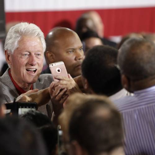 Bill Clinton meets with supporters while campaigning for his wife Democratic presidential candidate Hillary Clinton Wednesday Sept. 14 2016 in North Las Vegas Nev