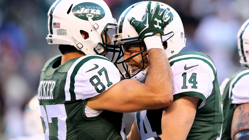 EAST RUTHERFORD NJ- NOVEMBER 29 Eric Decker #87 of the New York Jets celebrates his touchdown with Ryan Fitzpatrick #14 in the third quarter against the Miami Dolphins