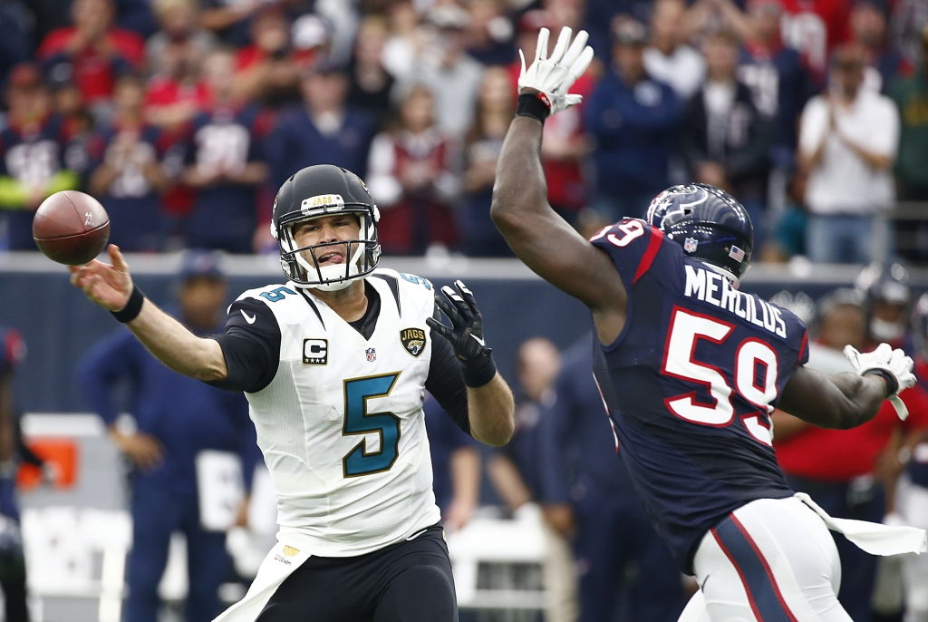 Blake Bortles of the Jacksonville Jaguars passes against Whitney Mercilus of the Houston Texans