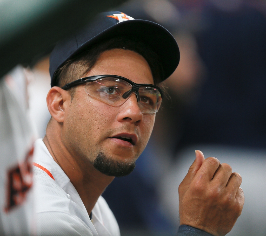 HOUSTON TX- AUGUST 30 Yulieski Gurriel #10 of the Houston Astros looks on from the dugout in the second inning against the Oakland Athletics at Minute Maid Park