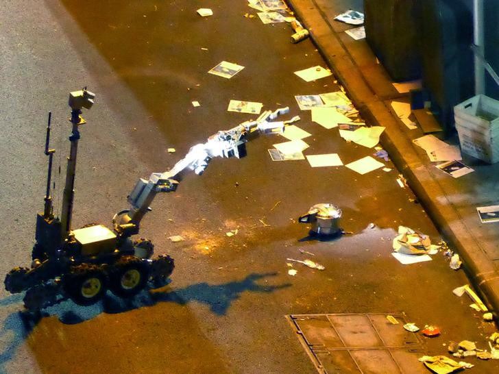 A New York Police Department robot retrieves an unexploded pressure cooker bomb on 27th Street hours after an explosion nearby in New York City New York