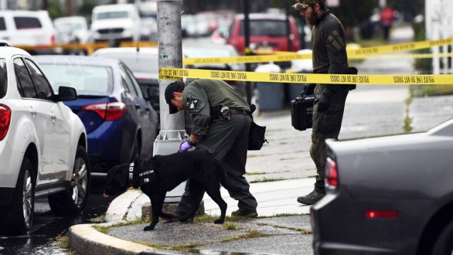 Investigators with the Federal Bureau of Investigation leave after searching the family restaurant and adjoined apartment of Ahmad Khan Rahami in Elizabeth New Jersey