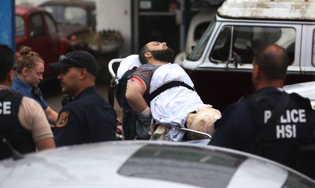 Ahmad Khan Rahami is taken into custody after a shootout with police Monday Sept. 19 2016 in Linden N.J. Rahami was wanted for questioning in the bombings that rocked the Chelsea neighborhood of New York and the New Jersey shore town of Seaside Park