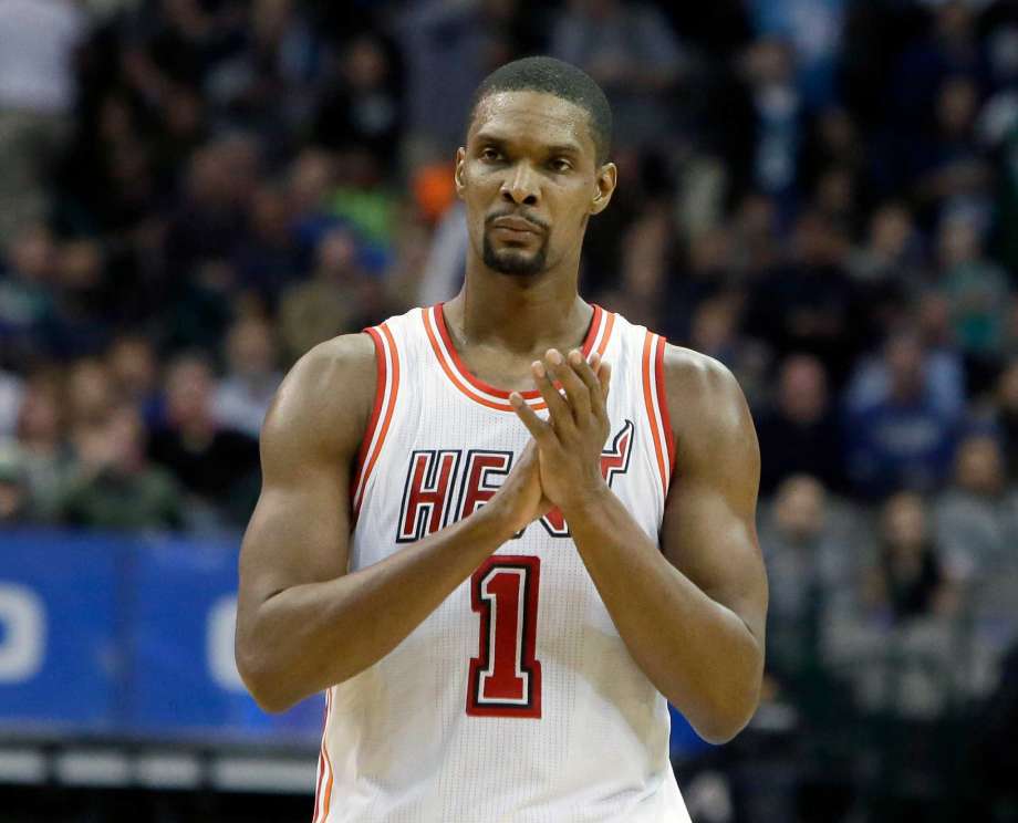 Miami Heat forward Chris Bosh reacts to a call during the second half of an NBA basketball game against the Dallas Mavericks in Dallas. Bosh was dealing with more than one blood clot earlier this year and sai