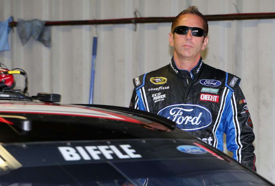 BROOKLYN MI- AUGUST 27 Greg Biffle driver of the #16 Roush Performance Ford stands in the garage area during practice for the NASCAR Sprint Cup Series Pure Michigan 400 at Michigan International Speedway