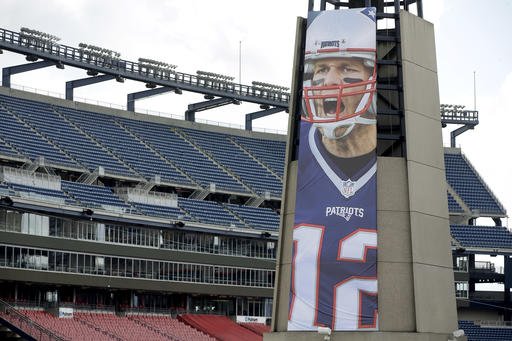 A oversized banner of New England Patriots Tom Brady is attached to the lighthouse at an entrance to Gillette Stadium Wednesday Sept. 7 2016 in Foxborough Mass