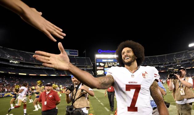 San Francisco 49ers quarterback Colin Kaepernick shakes hands with fans after the 49ers defeated the San Diego Chargers 31-21 during an NFL preseason football game Thursday Sept. 1 2016 in San Diego