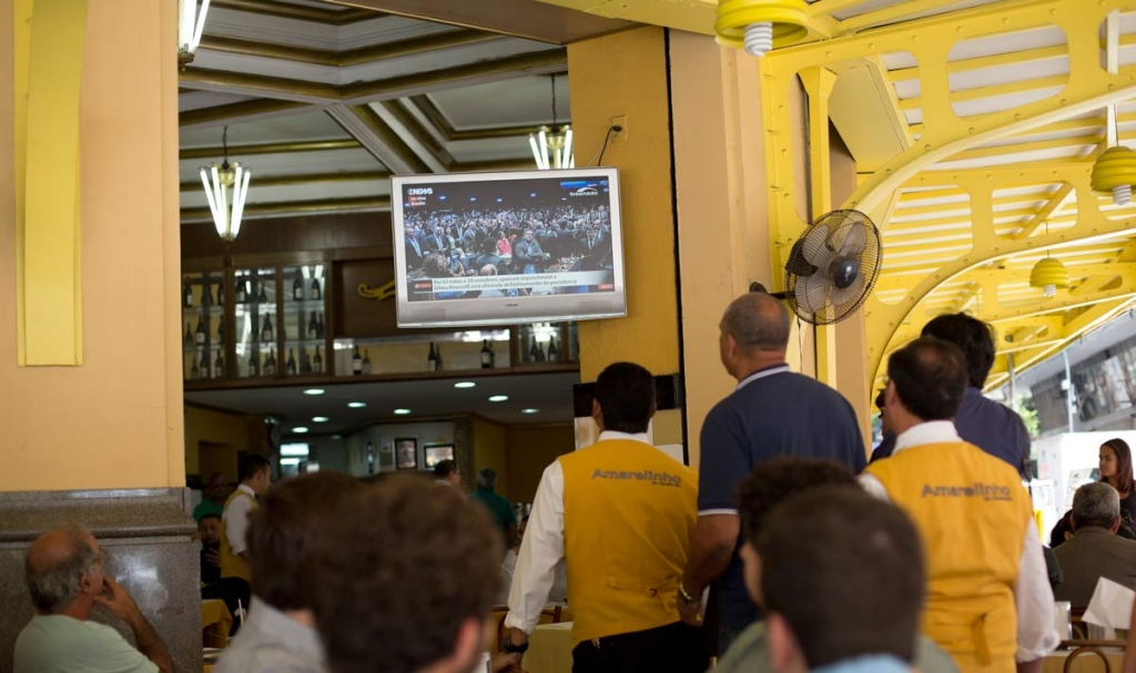 People watch the final vote of Brazil's Senate on whether to permanently remove suspended President Dilma Rousseff at a restaurant in Rio de Janeiro Brazil Wednesday Aug. 31 2016