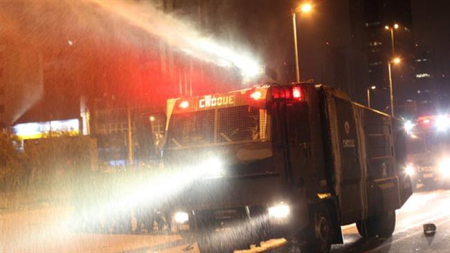 Brazil’s riot police spray water against demonstrators during a rally against President Michel Temer in Sao Paulo Sept. 4 2016