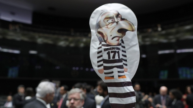 An inflatable doll with the likeness of former President of the Chamber of Deputies Eduardo Cunha floats in the Chamber of Deputies in Brasilia on Monday