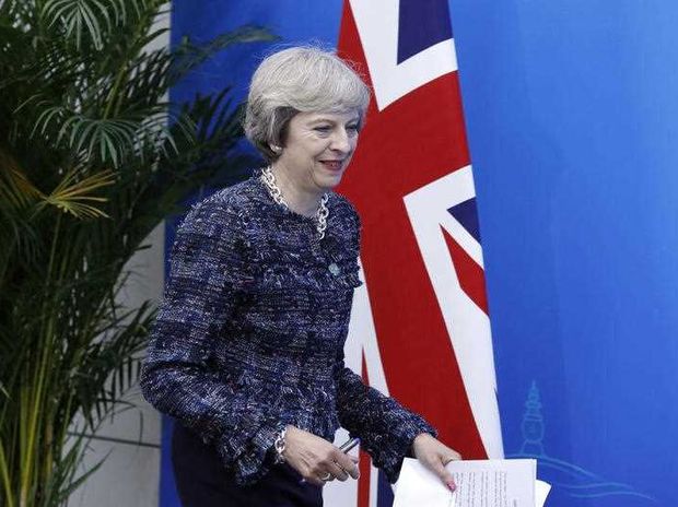 British Prime Minister Theresa May arrive for a press conference held at the end of the G-20 summit in Hangzhou in eastern China's Zhejiang province Monday Sept. 5 2016