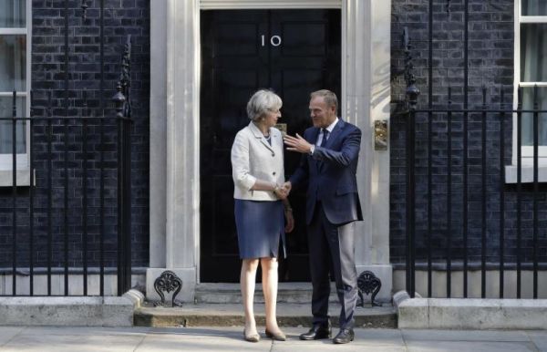 Britain's Prime Minister Theresa May left welcomes President