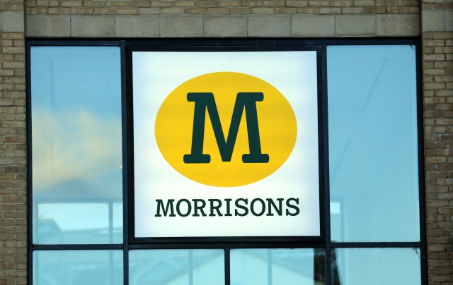 Morrisons reports profit for first time in four years