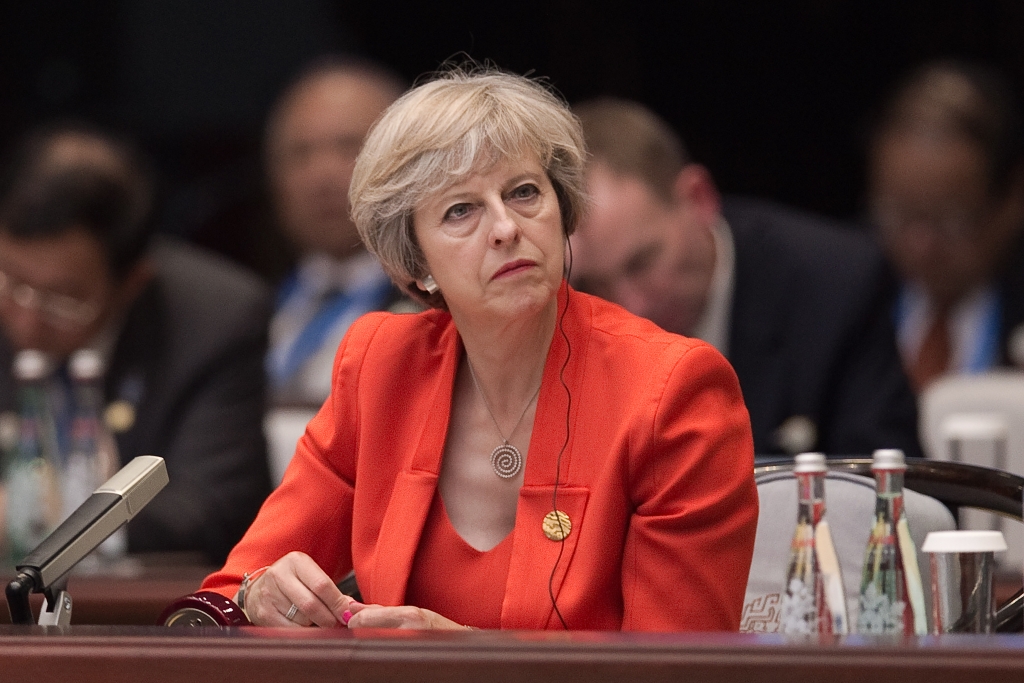 Britain's Prime Minister Theresa May listens to Chinese President Xi Jinping speech during the opening ceremony of the G20 Leaders Summit