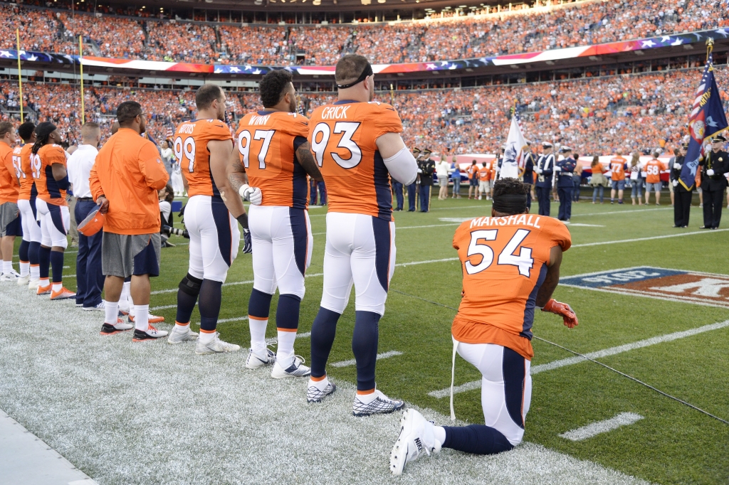 DENVER CO- SEPTEMBER 08 Linebacker Brandon Marshall of the Denver Broncos takes a knee during the national anthem before the first quarter. The Denver Broncos hosted the Carolina Panthers on Thursday