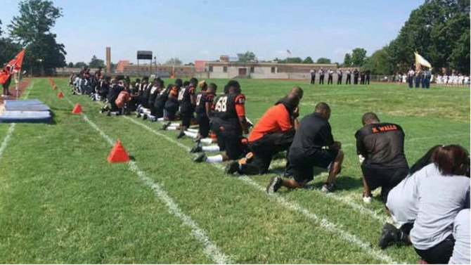 High School Students Kneel During National Anthem