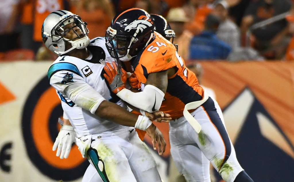 Sep 8 2016 Denver CO USA Denver Broncos inside linebacker Brandon Marshall collides with Carolina Panthers quarterback Cam Newton in the third quarter at Sports Authority Field at Mile High. Mandatory Credit Ron Chenoy-USA TODAY Sports