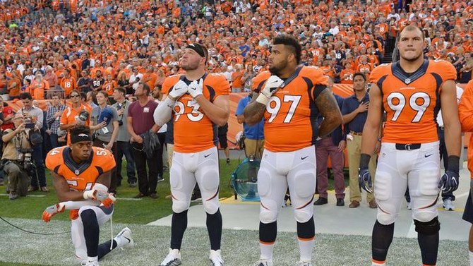 Brandon Marshall kneels during the national anthem. Ron Chenoy-USA TODAY Sports