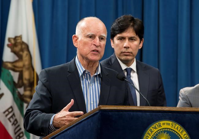 Calif. Gov. Jerry Brown announced that he would sign a pair of environmental bills approved by the Legislature during a news conference in Sacramento Calif. At right is Senate President Pro Tem Kevin