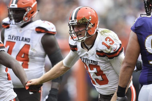 Cleveland Browns quarterback Josh Mc Cown struggles to his feet after taking a hit form Baltimore Ravens inside linebacker C.J. Mosley in the second half of an NFL football game Sunday Sept. 18 2016 in Cleveland