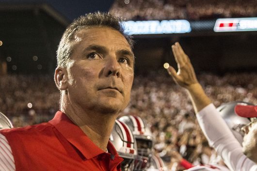 OSU coach Urban Meyer studies his opponent before the Buckeyes game against the Oklahoma Sooners on Sept. 17 at Gaylord Family Memorial Stadium. The Buckeyes won 45-24. Credit Alexa Mavrogianis