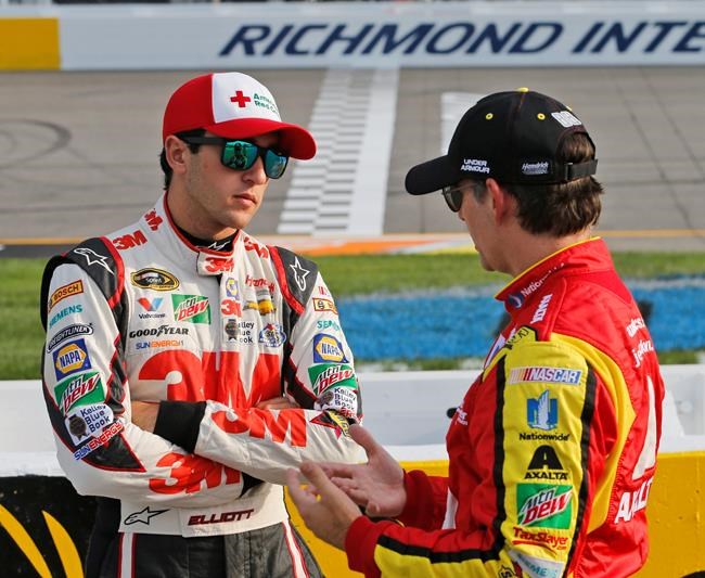 Jeff Gordon right talks with Chase Elliott prior to NASCAR Sprint Cup qualifying at Richmond International Raceway in Richmond Va. Friday Sept. 9 2016