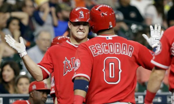 Los Angeles Angels Yunel Escobar is congratulated