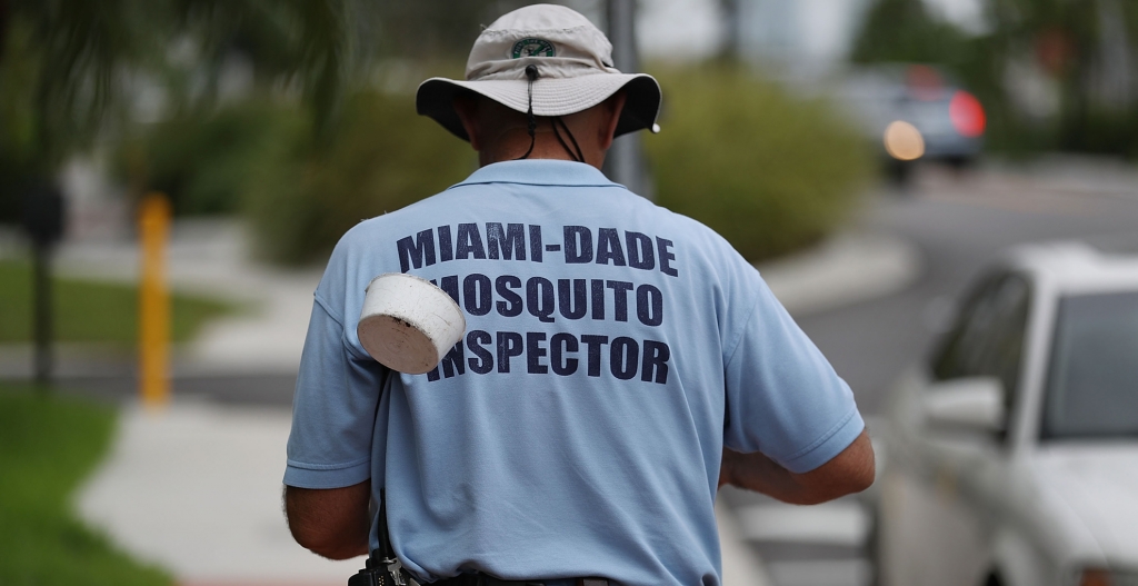 Carlos Varas a Miami Dade County mosquito control inspector walks through the streets looking for places that might hold breeding mosquitos that are carrying the Zika virus on Sept. 2 2016 in Miami Beach Florida