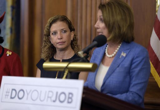 Rep. Debbie Wasserman-Schultz D-Fla. listens at left as House Minority Leader Nancy Pelosi of Calif. speaks during a news conference about the Zika virus Wednesday Sept. 7 2016 on Capitol Hill in Washington