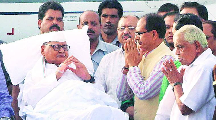 CM Shivraj Singh Chouhan bids farewell to Ramnaresh Yadav at Raja Bhoj Airport in Bhopal on Wednesday. PTI