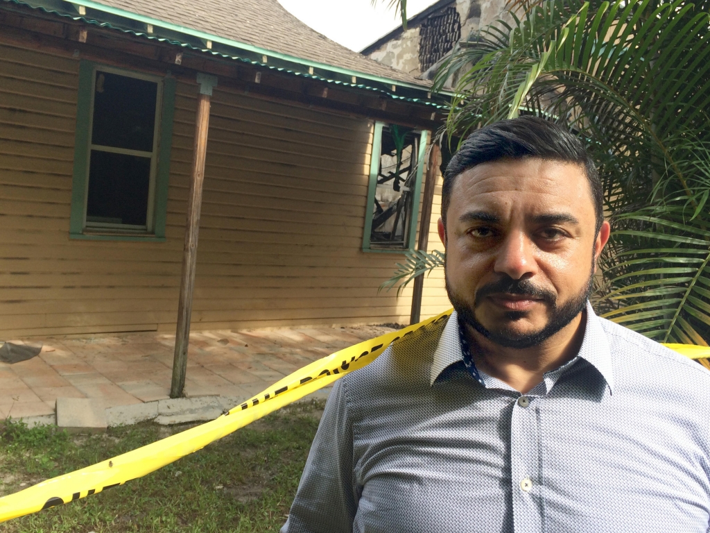 Ahmed Bedier a Muslim community activist stands outside the Fort Pierce mosque damaged in arson attack this week. He says Clinton's comments were probably'unwise but'honest