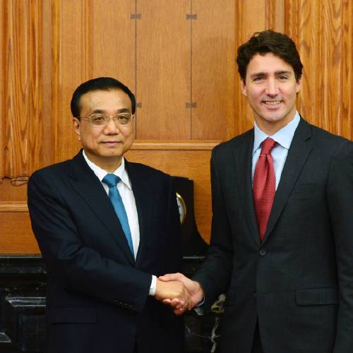 Minister Justin Trudeau greets Chinese Premier Li Keqiang left as holds an expanded meeting in the Cabinet room on Parliament Hill in Ottawa on Thursday Sept. 22 2016