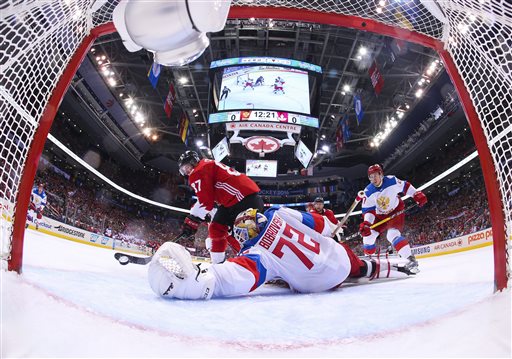 Team Canada's Sidney Crosby scores on Team Russia's goalie Sergei Bobrovsky  during the first period of a World Cup of Hockey semifinal game Saturday Sept. 24 2016 in Toronto