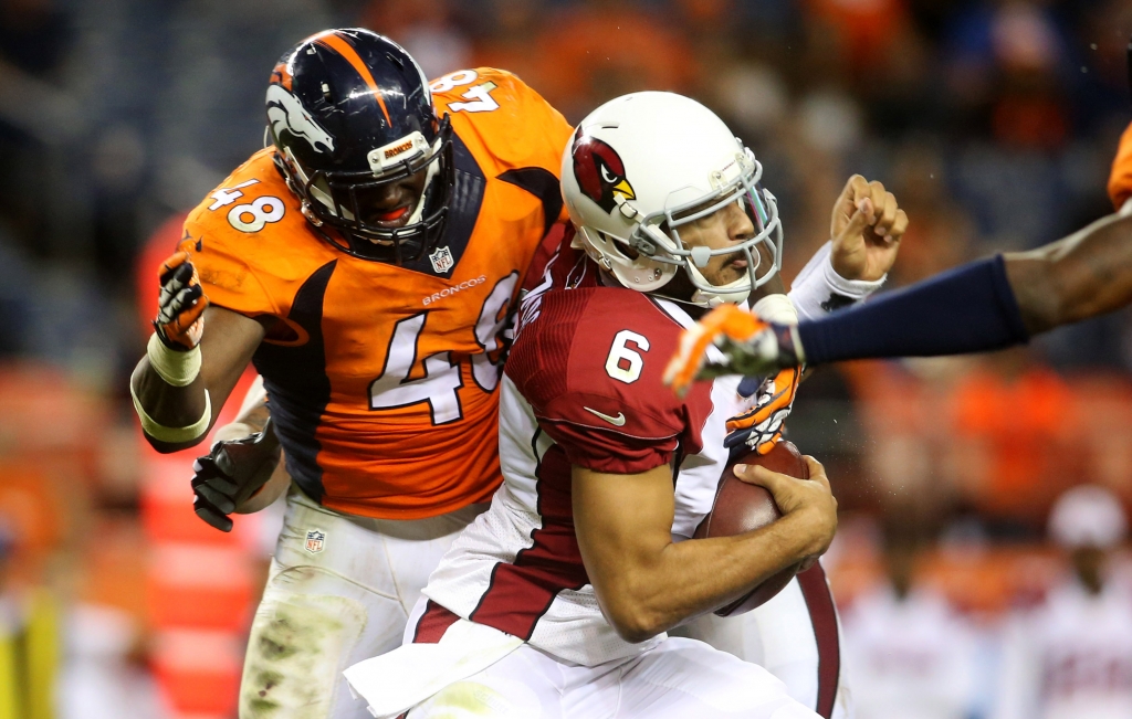 Sep 3 2015 Denver CO USA Denver Broncos linebacker Shaquil Barrett sacks Arizona Cardinals quarterback Logan Thomas during the second half at Sports Authority Field at Mile High. The Cardinals won 20-22. Mandatory Credit Chris Humphreys-USA