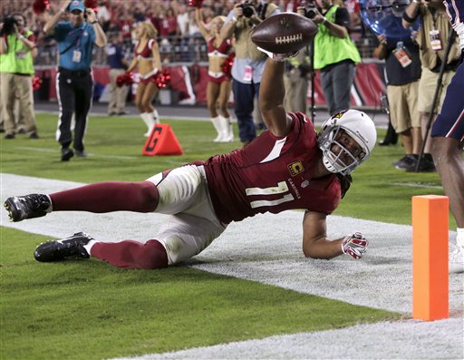 Arizona Cardinals wide receiver Larry Fitzgerald catches his career 100th touchdown pass during the second half of an NFL football game against the New England Patriots Sunday Sept. 11 2016 in Glendale Ariz