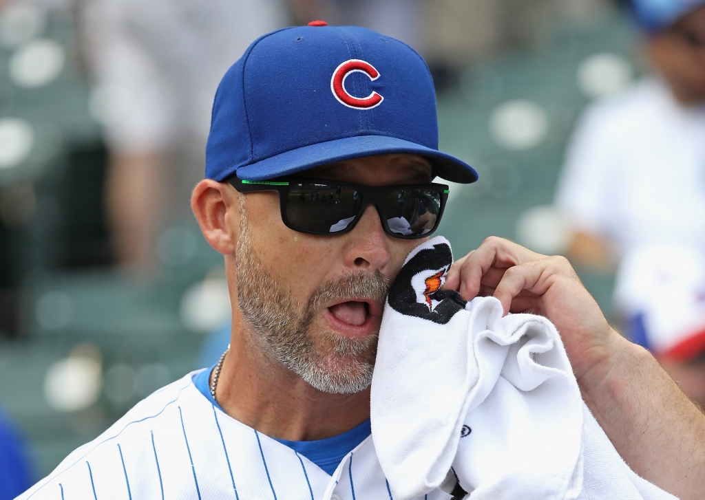 CHICAGO IL- SEPTEMBER 23 David Ross #3 of the Chicago Cubs who is retiring after the season wipes a tear from his eye as he watches a video tribute of his career before a game against the St. Louis Cardinals at Wrigley Field