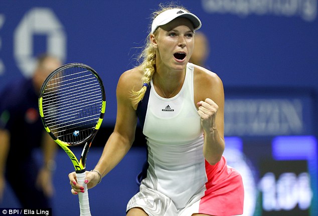 Caroline Wozniacki celebrates on her way to reaching the semi-finals at the US Open