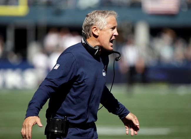 Seattle Seahawks head coach Pete Carroll calls to his team in the first half of an NFL football game against the Miami Dolphins Sunday Sept. 11 2016 in Seattle