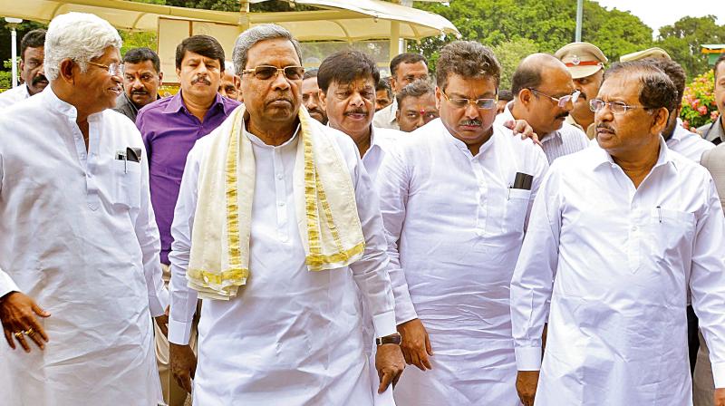 Chief Minister Siddaramaiah and his ministers arrive for a cabinet meeting at Vidhana Soudha on Wednesday