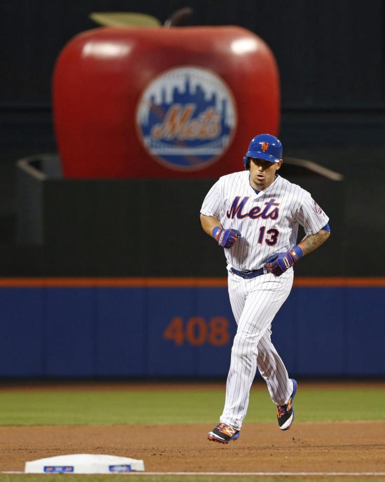 New York Mets&#39 Asdrubal Cabrera heads toward third after hitting a first-dining two-run home run in a baseball game against the Miami Marlins Tuesday Aug. 30 2016 in New York