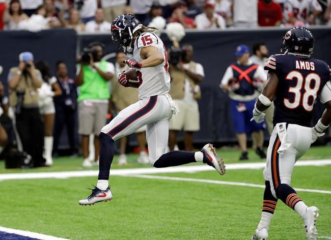 Houston Texans wide receiver Will Fuller runs past Chicago Bears free safety Adrian Amos to score a touchdown during the second half of an NFL football game Sunday Sept. 11 2016 in Houston