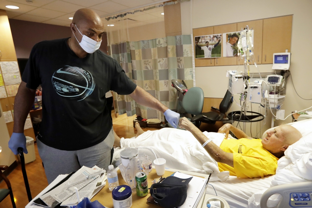 NBA Hall of Fame member and TNT colleague Charles Barkley left bumps fists with sportscaster Craig Sager after visiting Sager Tuesday Aug. 30 2016 at MD Anderson Cancer Center in Houston. Sager underwent his third bone marrow transplant Wednesday Aug