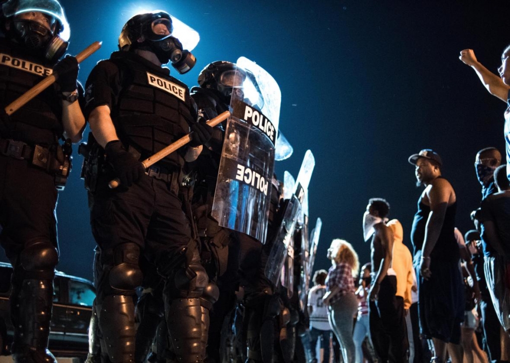 609480558-police-officers-face-off-with-protestors-on-the-i-85