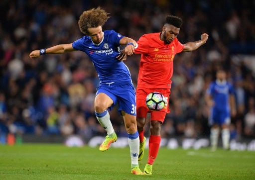 Chelsea's Brazilian defender David Luiz vies with Liverpool's English striker Daniel Sturridge during the English Premier League football match between Chelsea and Liverpool at Stamford Bridge in London